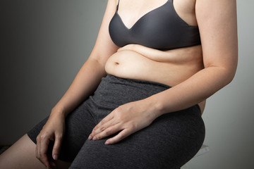 Fototapeta na wymiar fat woman cellulite belly unhealthy