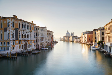 Naklejka na ściany i meble Venice, Grand Canal at sunrise with Saint Mary of Health basilica in Italy