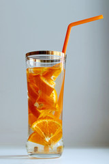 orange detox-water in a glass Cup