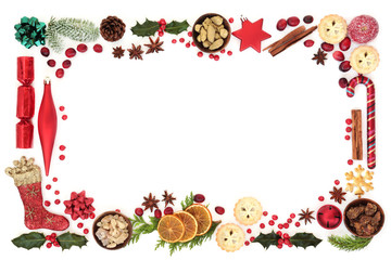 Christmas festive background border with decorations, food, winter flora, seasonal symbols and...