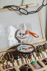 Fototapeta premium Round cookies mask for Halloween and set of drills