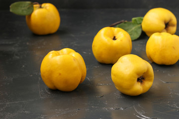 Ripe yellow quince fruit on dark background, healthy lifestyle, nutrition 