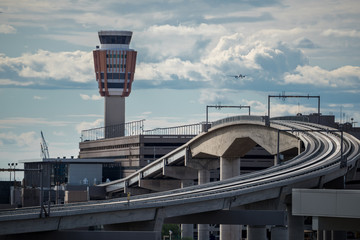 train tracks and airport control tower