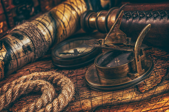 Old vintage compass on ancient map