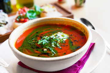 Traditional Italian tomato soup gazpacho with basil.