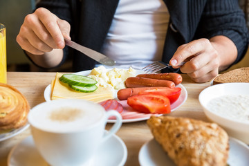 Man eating a healthy breakfast at home