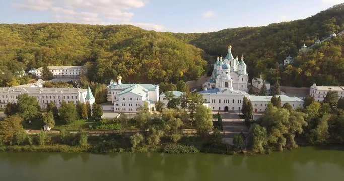 Orthodox Lavra in the forest on the slopes of the river banks. Ukraine. Svyatogorsk