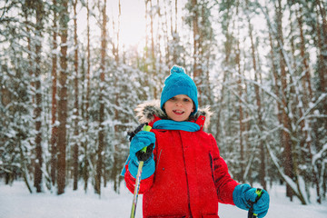 Fototapeta na wymiar young boy ski in winter nature, seasonal sport