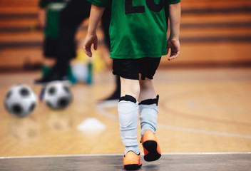 Kids futsal training. Indoor soccer players training with balls. Sport background. Indoor soccer...