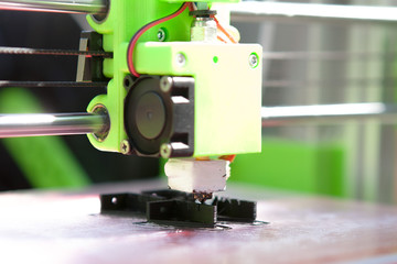 A desktop 3d printer in the laboratory for prints a structure from a polymer