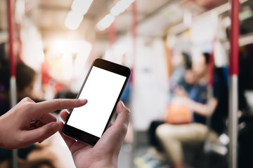 Close up Woman hand Using a Smart Phone with blank screen at subway station.