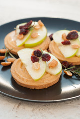 Snack for whine. Crispy butter cookies, biscuits with apple slices and honey. Delicious breakfast or snack. Sweet healthy dessert.