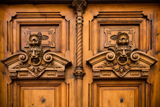 details of ornate wooden door with carvings in Valencia, Spain