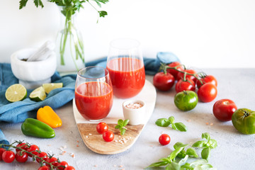 The juice from the tomatoes and peppers on grey background