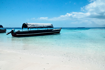 Boat boats on the blue sea ocean paradise island