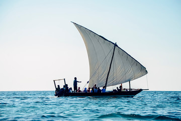 Sailboat sailing in ocean blue sea