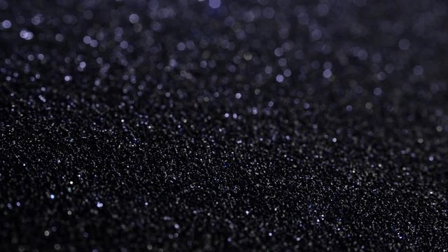 Black sand grunge background. Сlose-up.
