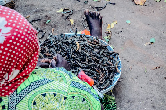 Black woman black beans dried in a sun african food