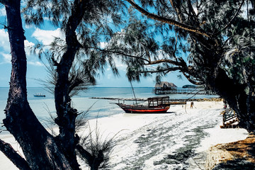 Paradise beach boat on white sand blue ocean