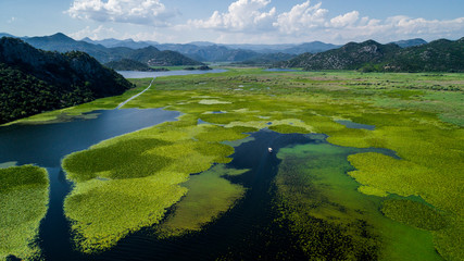 Aerial view of the beautiful landscape of Lake Skadar in the mountain on a sunny day. Montenegro....