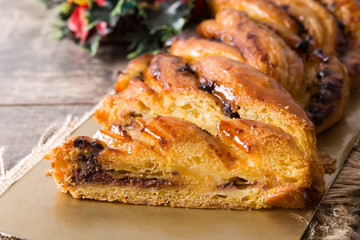 Homemade braid chocolate on wooden table. Close up