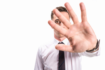 Fototapeta premium businessman in shirt and tie showing stop sign isolated on white