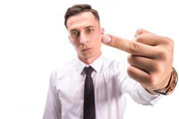 selective focus of angry businessman showing middle finger isolated on white