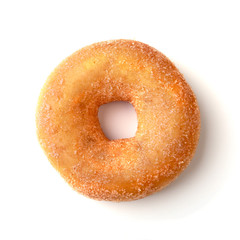 assorted delicious homemade doughnuts in the glaze, colorful sprinkles and nuts isolated on white background.