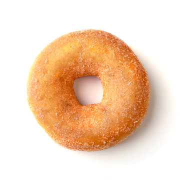 assorted delicious homemade doughnuts in the glaze, colorful sprinkles and nuts isolated on white background.