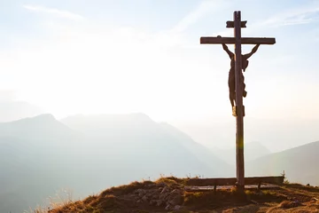 Deurstickers Wooden crucifix with Jesus on a mountain hill © Evgeni Dinev