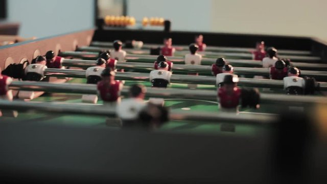 Play table football game miniature recreation grass color attack fun soccer competition teamwork entertainment plastic ball goal toy play sport action detail field team green kicker match