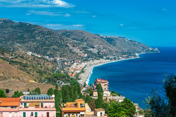 Beach view from Taormina.  Taormina has been main  tourist destination in Sicily since the 19th century. Taormina, Sicily, Italy.