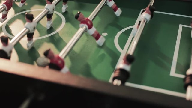 close up sunlight table football game miniature recreation grass color attack fun soccer competition player teamwork entertainment plastic ball goal toy play sport field team green kicker match