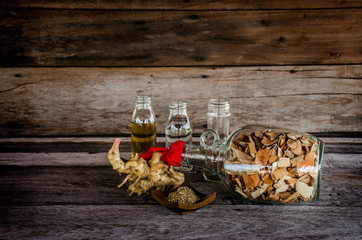 herbal liqour on wood background