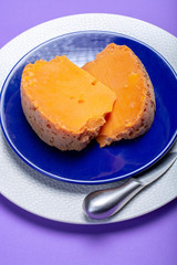 Two pieces of native French aged cheese Mimolette, produced in Lille with greyish curst made by special cheese mites