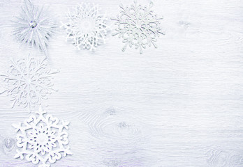 Fototapeta premium Christmas and New Year. Christmas toys, snowflakes on a wooden
