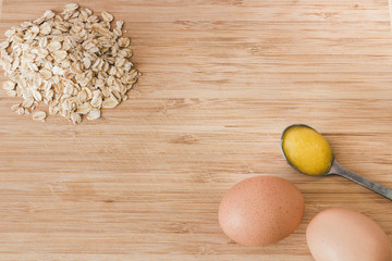 Raw oatmeal with ingredients honey and egg