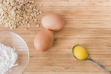 Raw oatmeal with ingredients honey and egg