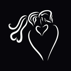 Kiss of a young couple, creative white heart on a black background