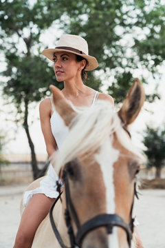 Portrait of woman riding horse