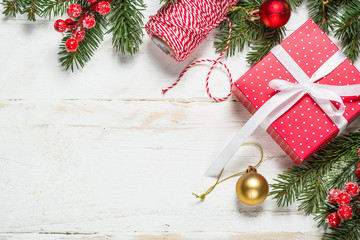 Christmas background with fir tree, present box and decorations 