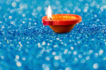Happy Diwali Clay Diya lamps lit during Dipavali Hindu festival of lights celebration