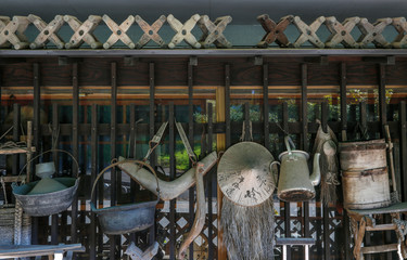 Fototapeta na wymiar Old utensils as decoration on the wall of Japanese house / restaurant.