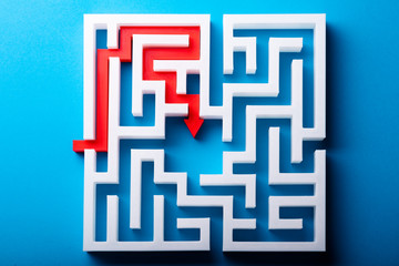 Red Arrow At The Center Of White Maze