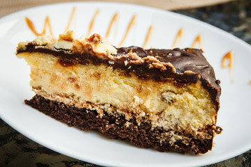closeup  small piece of cheesecake with chocolate