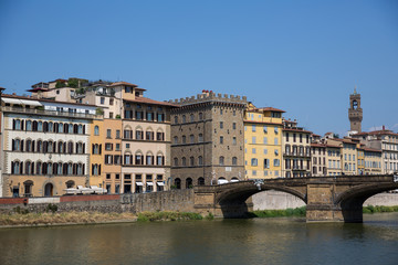 Fototapeta na wymiar St Trinity bridge and Buildings on the banks of the river Arno in Florence, Tuscany, Italy