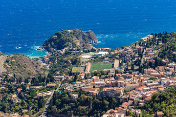 Fototapeta na wymiar The view from the small village Castelmola at mountain top above Taormina, with the view of Mediterranean Sea and the skyline of Taormina.
