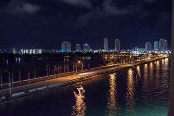 wide angle shot of highway leading to downtown miami, florida on a summer night