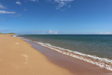 Sand, sea and lighthouse