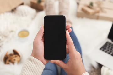 Christmas online shopping background. Smartphone screen with copy space